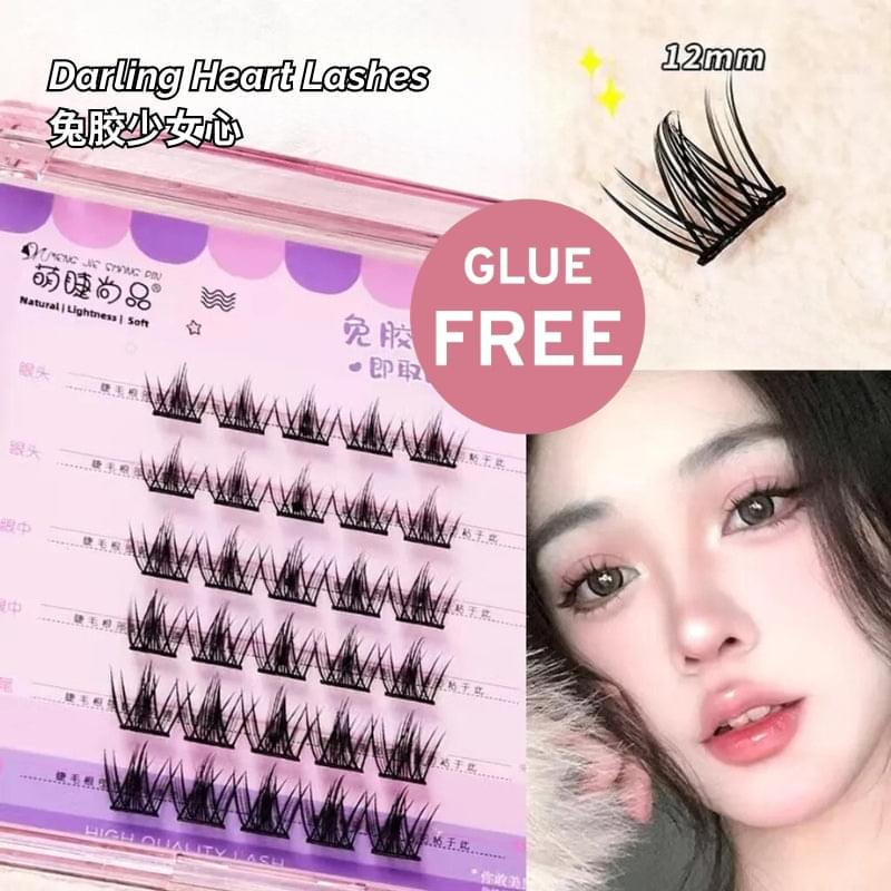 Self-adhesive false eyelash strips with wispy curled lashes, shown on a card