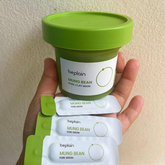 Mung bean pore clay mask jar with pore serum sachets held in hands