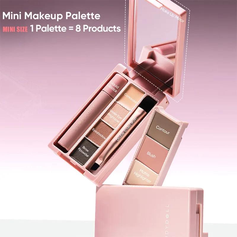 Rose-pink mini makeup palette with fold-out pans and built-in applicator brush
