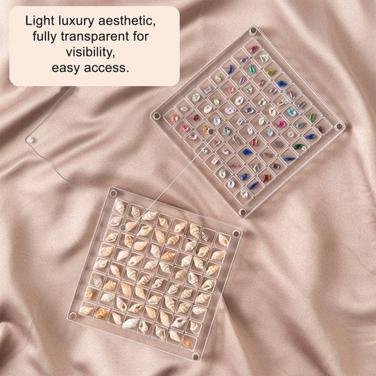 Clear acrylic magnetic grid display boxes with seashell beads compartments, angled view