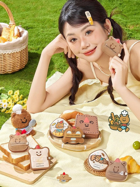 Assorted toast and animal-shaped makeup sponges set on a tabletop and in hand