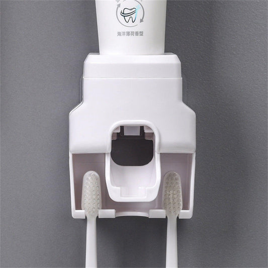 White wall-mounted toothpaste dispenser squeezer with front slot and side brush holders
