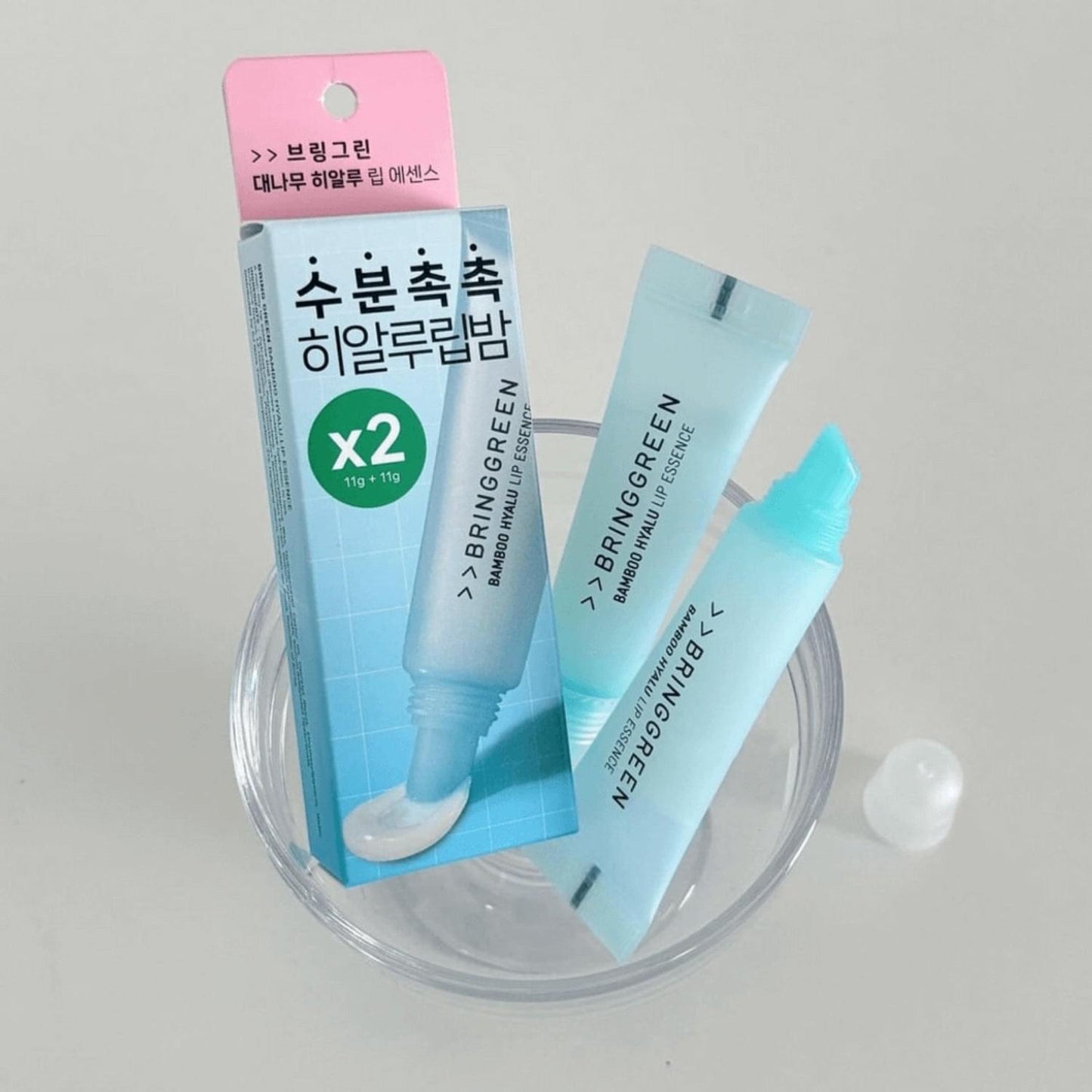 Bamboo Hyalu lip essence double set with two tubes on clear tray