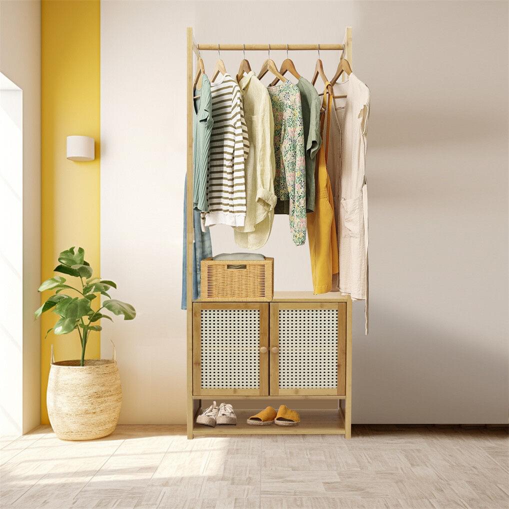 Bamboo clothes rack with hanging bar and perforated cabinet doors, open lower shelf