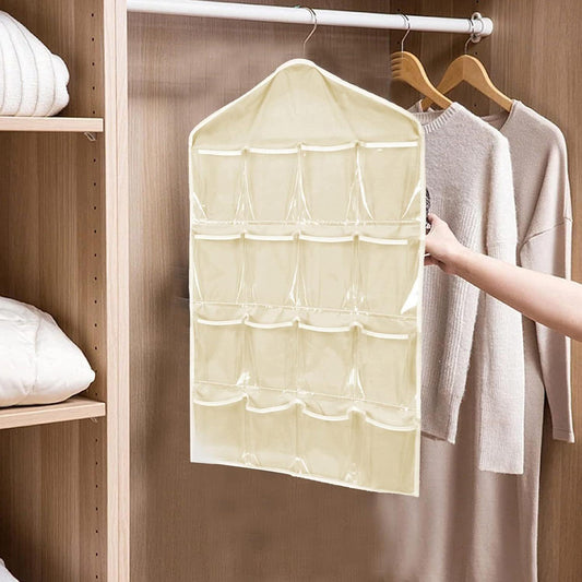 Beige hanging closet organizer bag with fabric pocket compartments and top hanger