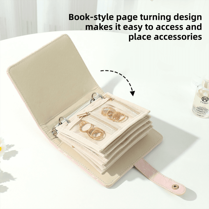 Book-style jewelry storage binder with hinged pages and ring loops for accessories.