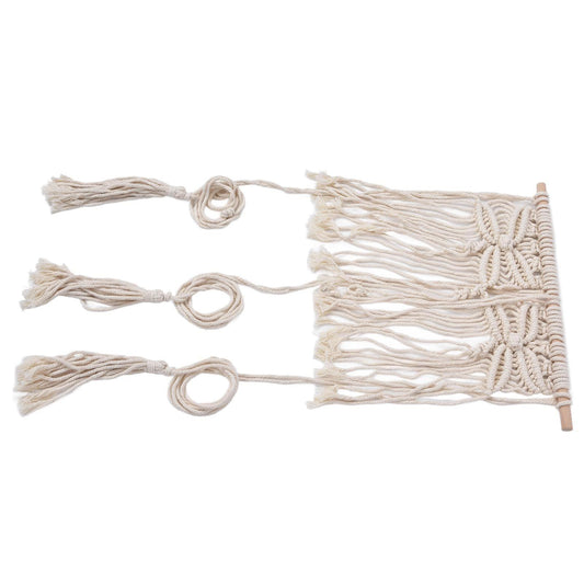 Woven off-white rope wall hanging rack with braided pattern and top bar