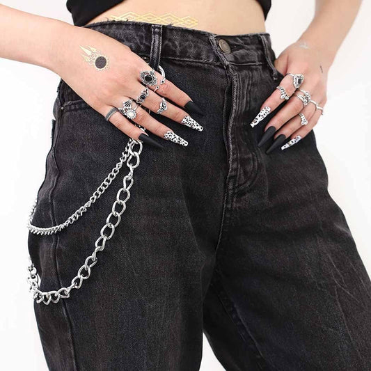 Black denim pants with long silver chain wallet and layered chain belt