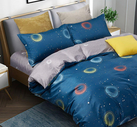 Blue duvet cover with circular bubble pattern and planet shapes, yellow and gray pillows
