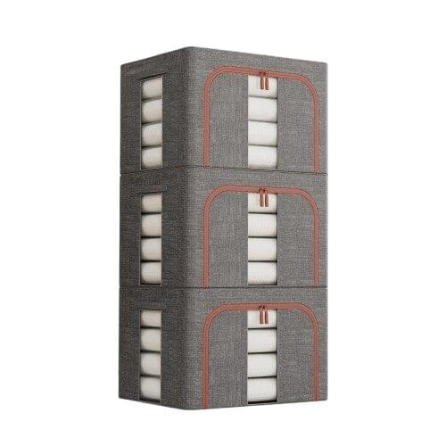 Three-pack of grey fabric clothes storage bins with orange-trimmed handles and clear window lids