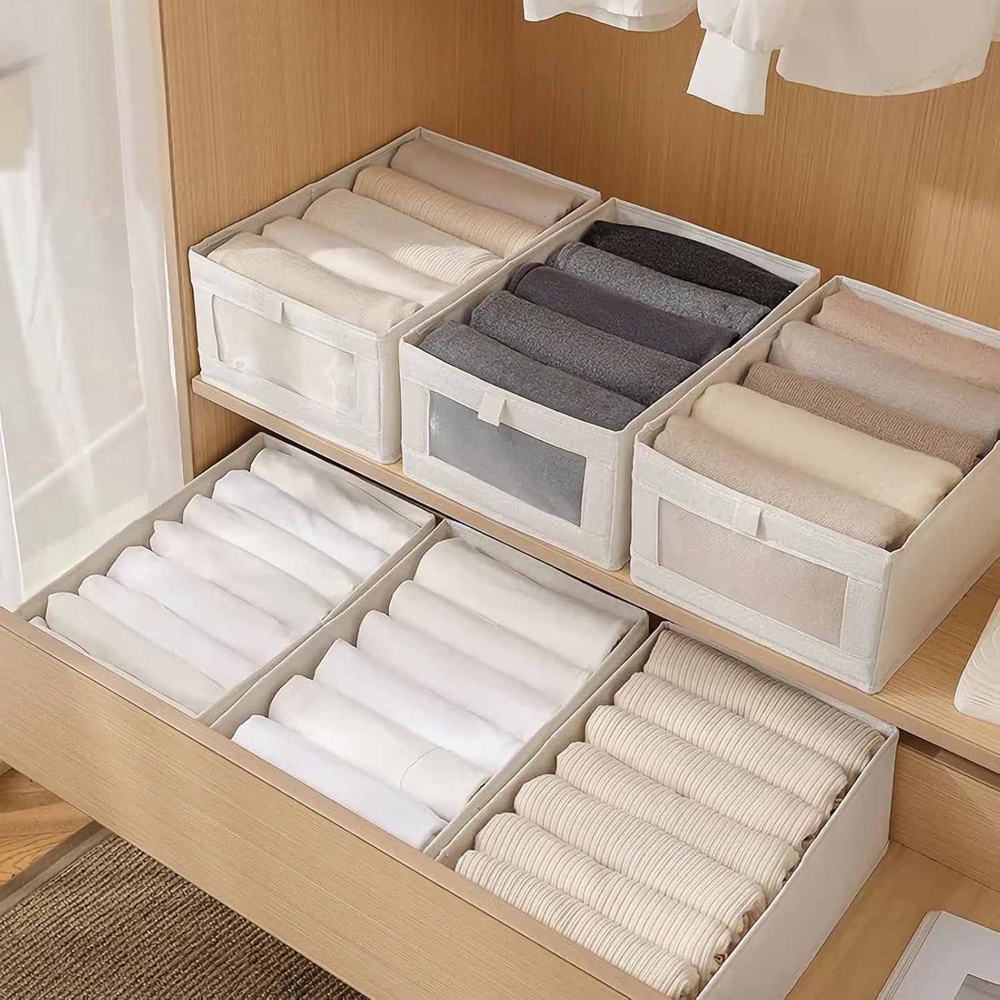 White fabric storage bins with clear front panels holding folded socks and clothing
