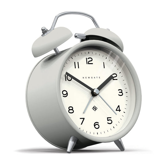 Matte grey twin-bell alarm clock, angled view with cream face and Newgate branding