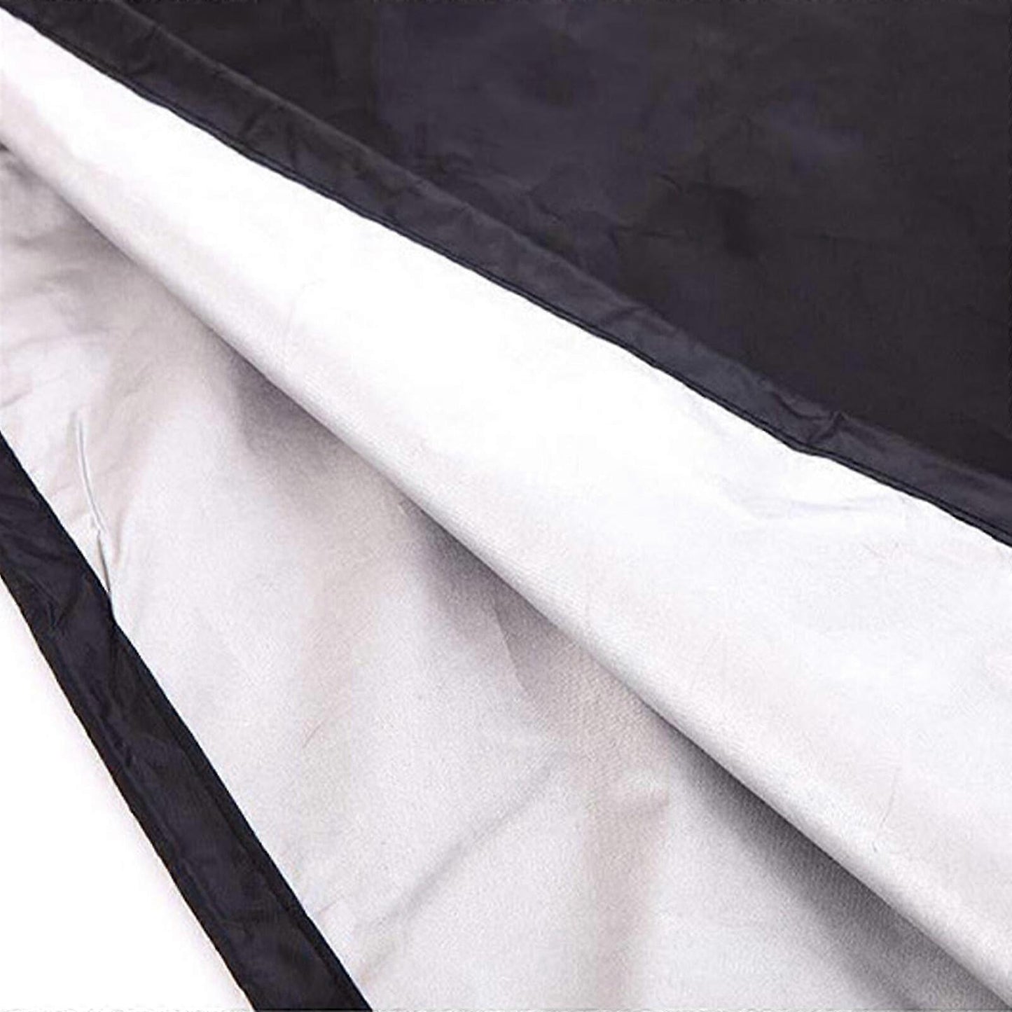 Black outer and light inner lining panels of storage bag with stitched seams