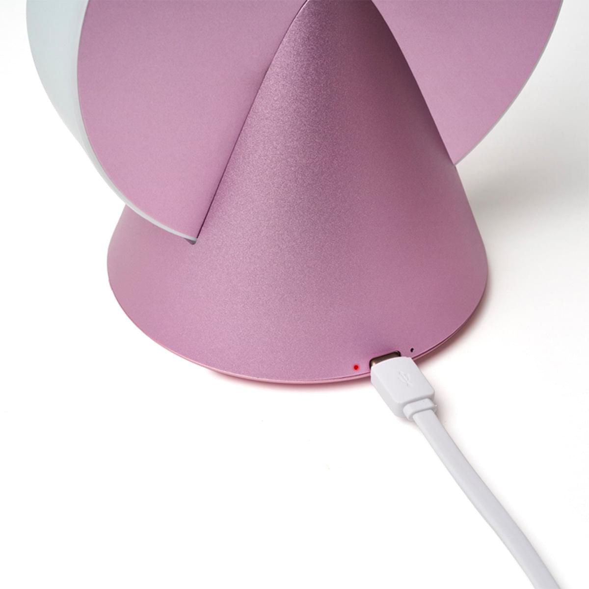 Pink conic LED lamp with charging port and white cable connection