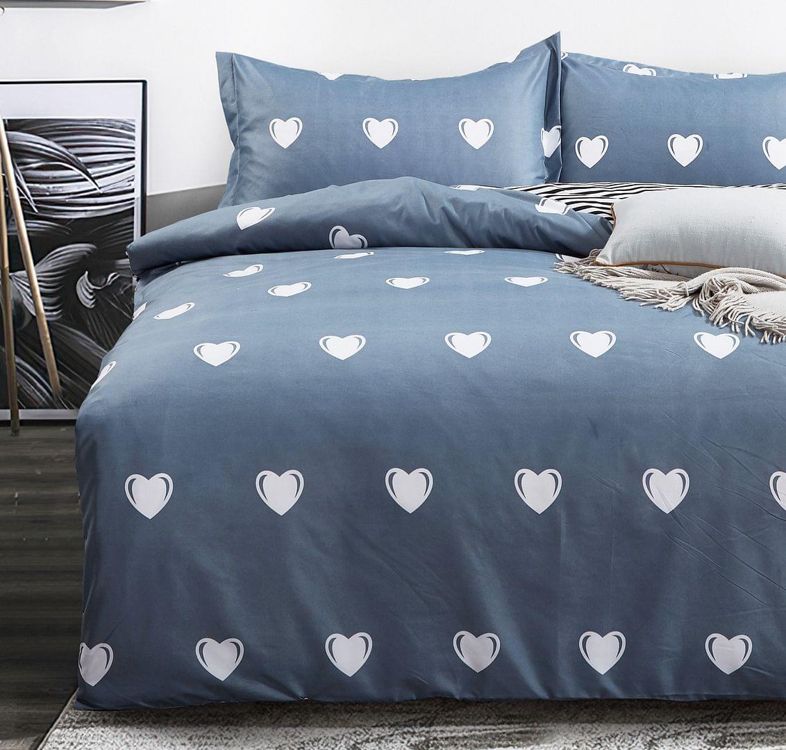 Queen duvet cover set in blue with white heart pattern and matching pillowcases