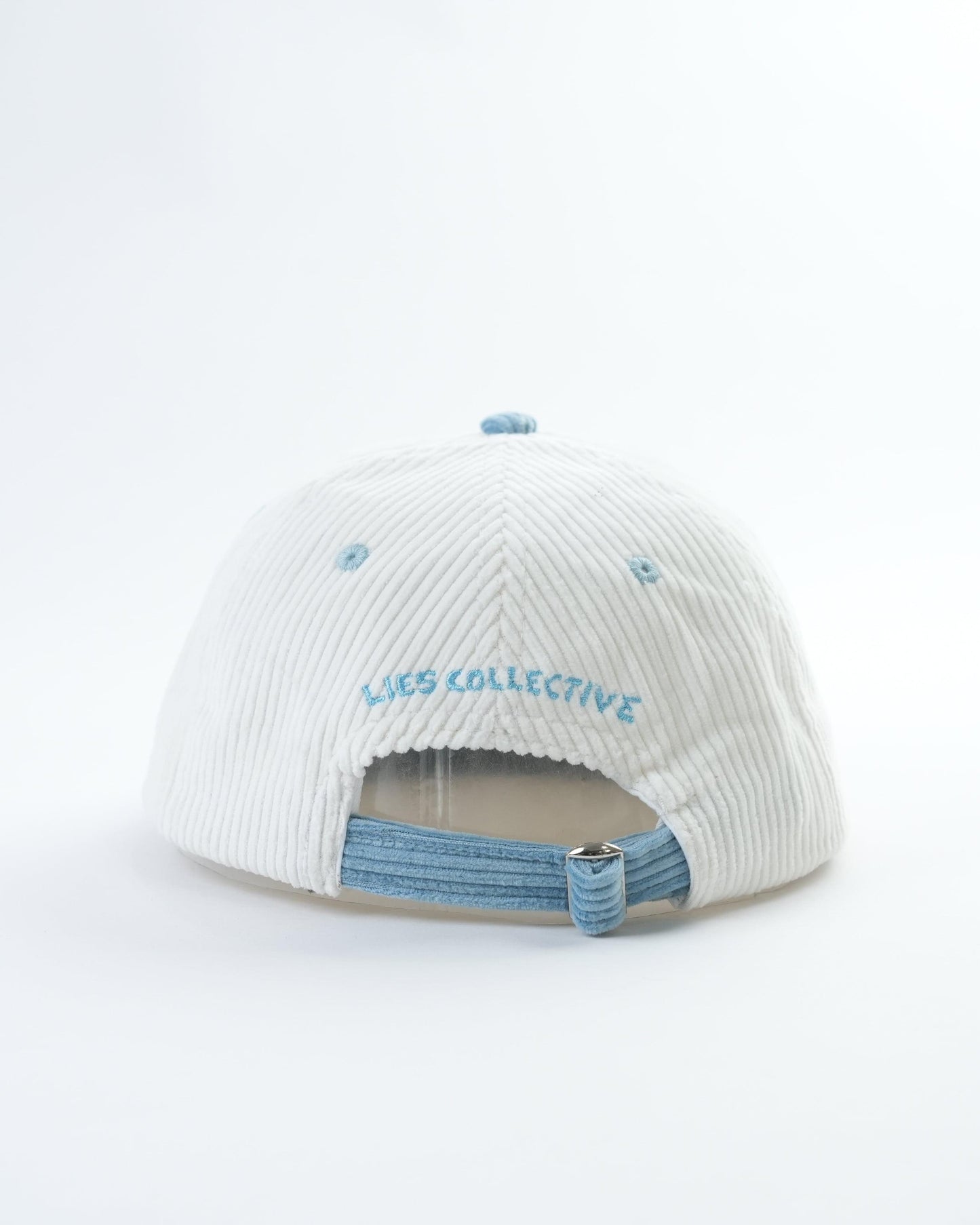 White striped knit cap with light blue brim, inside elastic strap and embroidered text