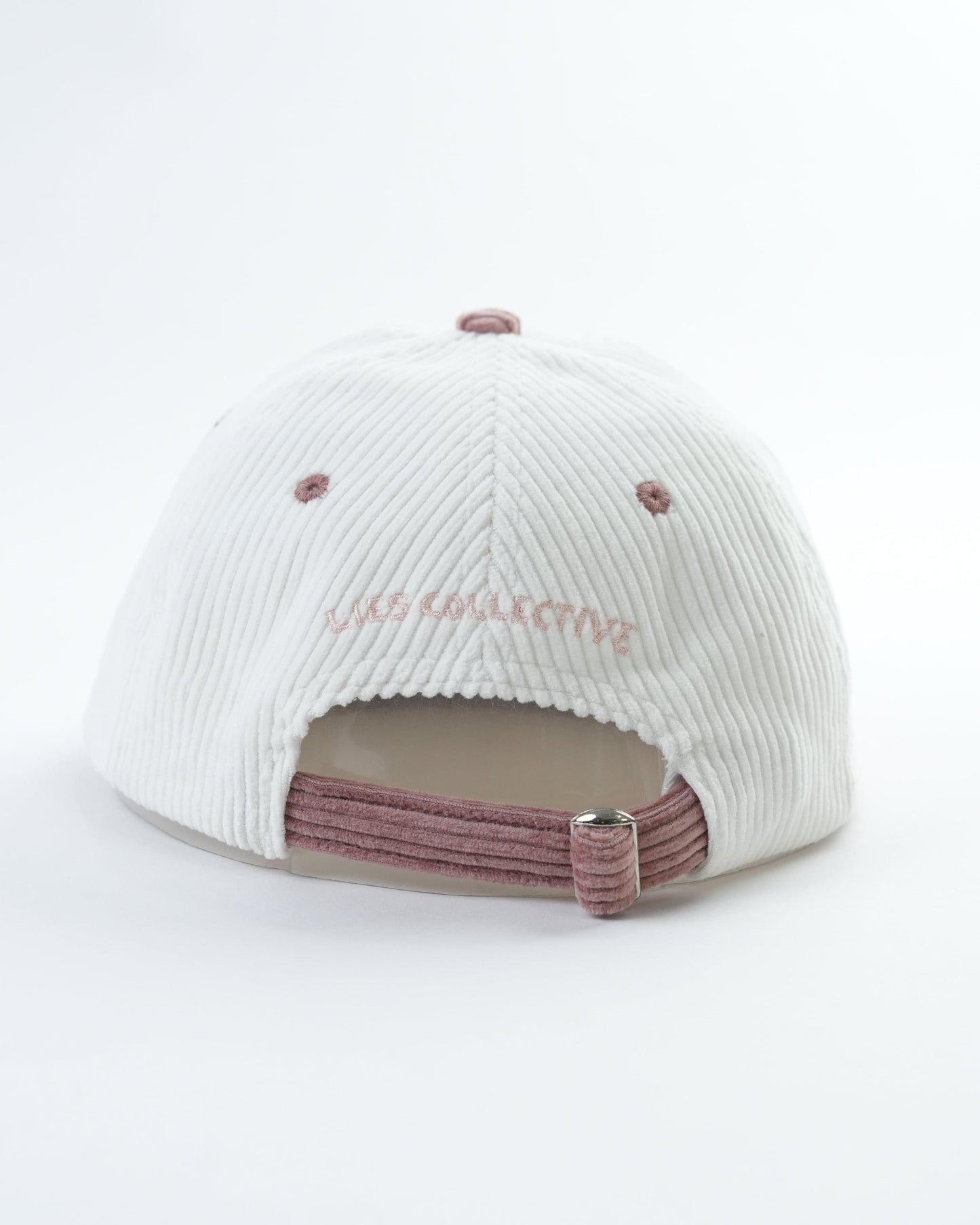 White ribbed baseball cap back with maroon adjustable strap and small metal buckle