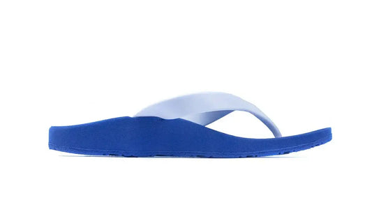 Kids blue flip-flop thong sandal with white ankle strap, side view