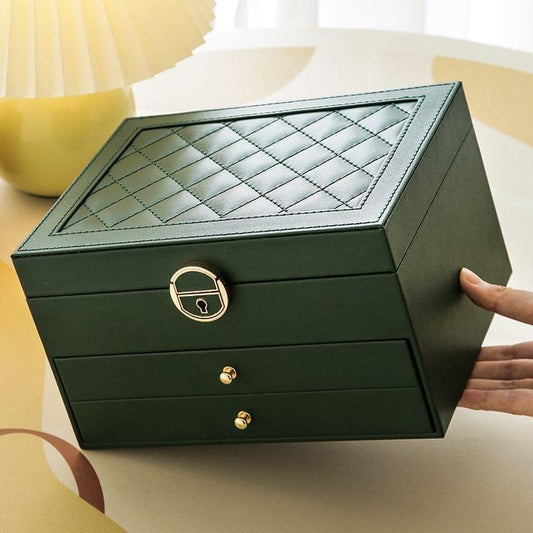 Dark green lockable PU leather jewelry box with quilted lid and front drawers.