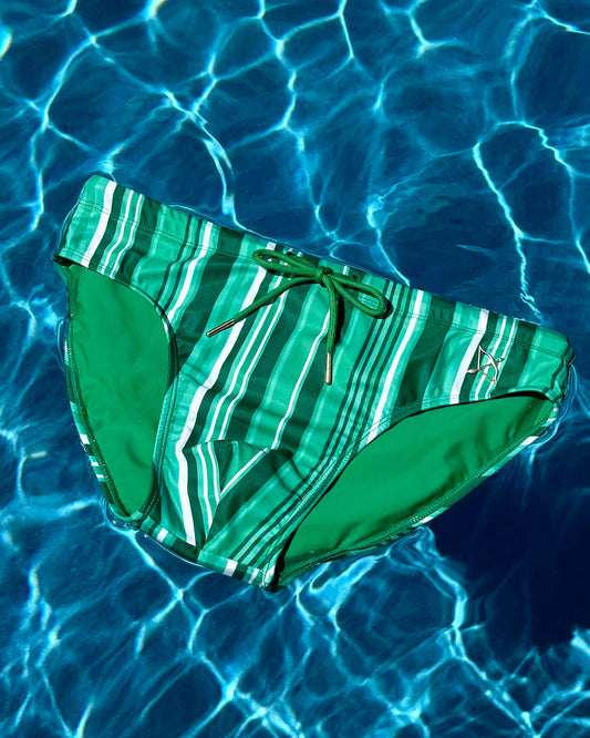 Green striped swim brief with drawstring bow, angled side view