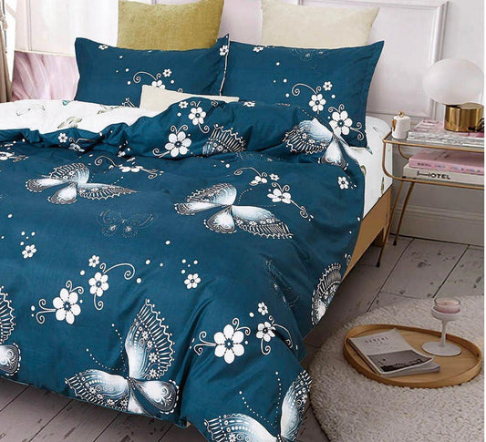 Blue bedding duvet cover set with white peacock and flower pattern, shown on bed