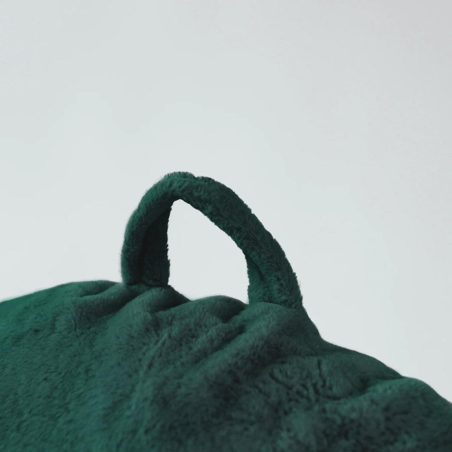 Emerald green beanbag chair handle loop, plush cover detail