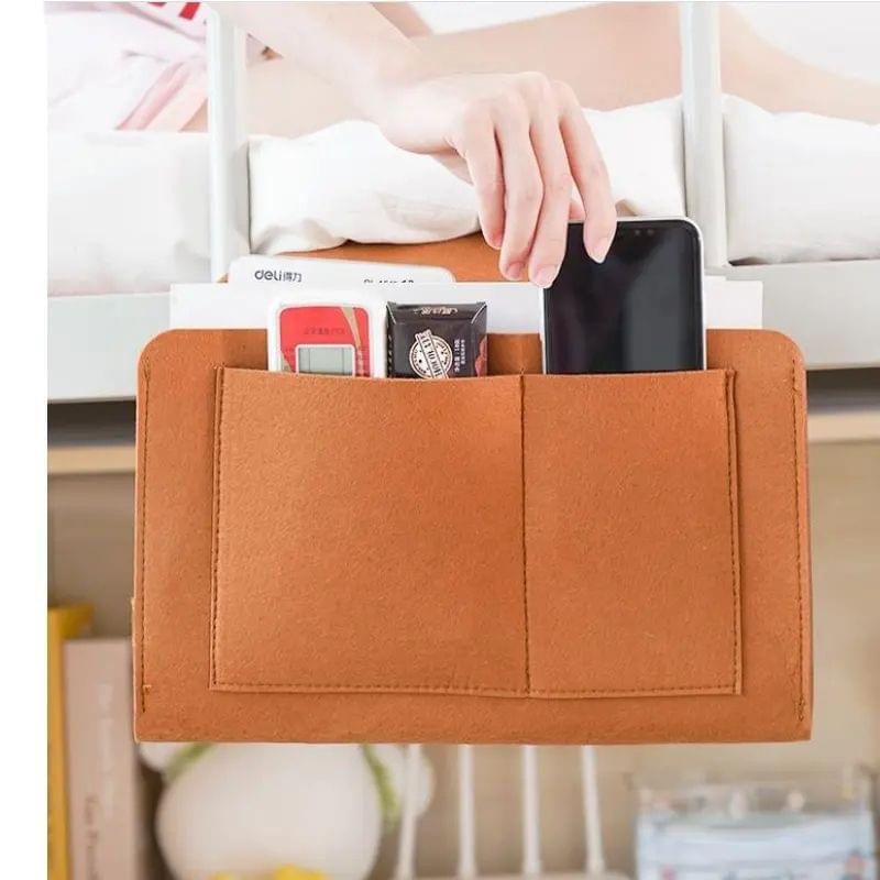 Orange felt storage bag pouch with front organizer pockets and phone sleeve