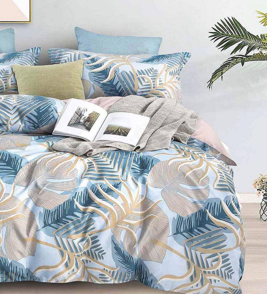 Super king quilt and duvet cover set with blue leaf print and matching square pillows
