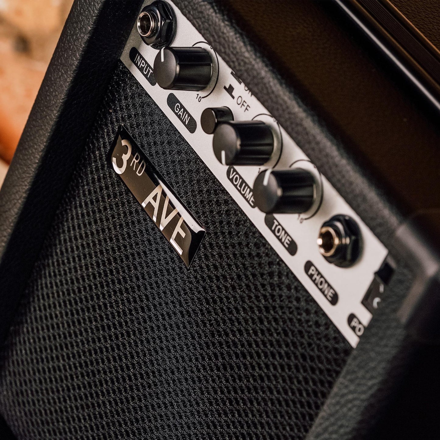 3rd Avenue 10W electric guitar amplifier control panel with gain, volume, tone, phone and power knobs