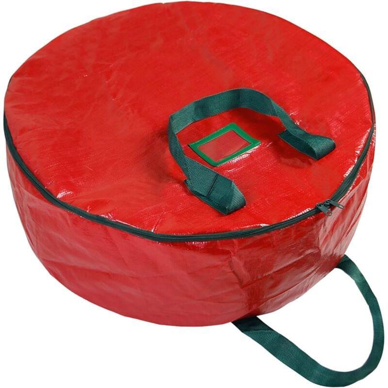 Red round wreath storage bag with green top handle and side strap