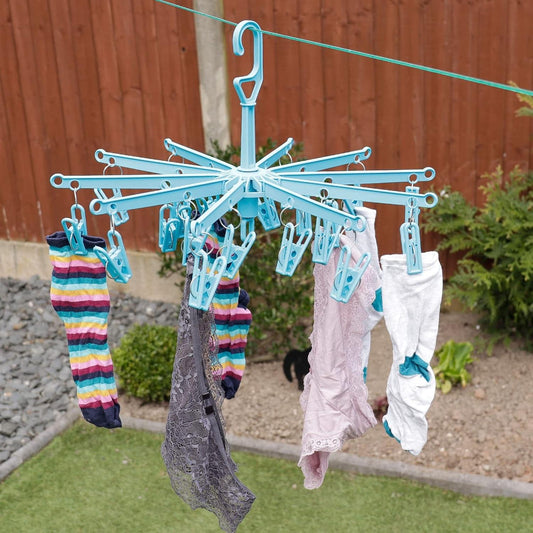 Blue clip laundry drying rack holding assorted socks and underwear
