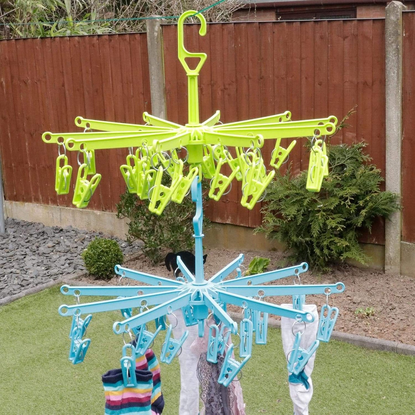 Lime clip laundry drying rack holding socks and baby clothes