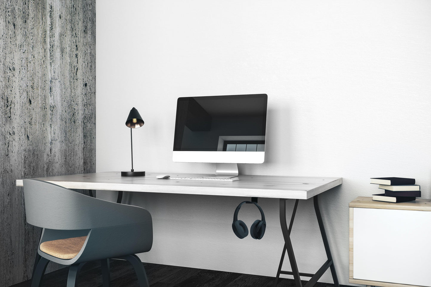 Black under-desk headphone hook with headphones stored under the desk