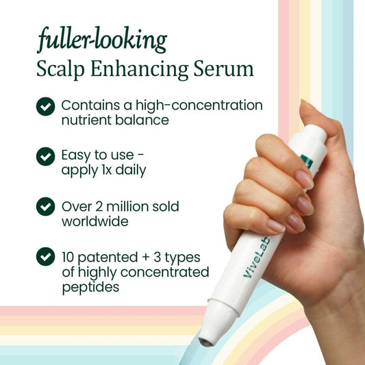 White scalp serum applicator pen held in hand