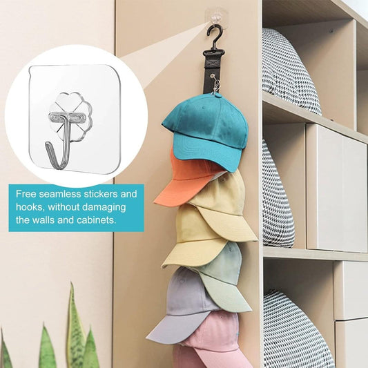 Hanging cap organizer with clear sticker hook, holding stacked baseball caps in teal and beige
