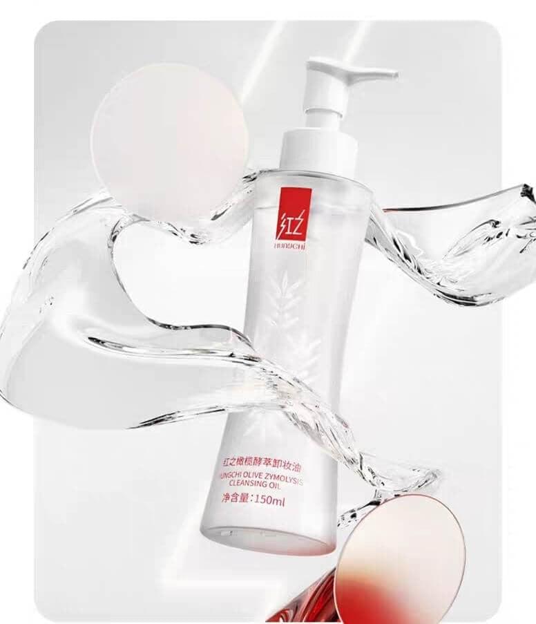 White cleansing oil pump bottle with water splash graphic, red label detail