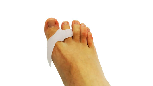 White silicone bunion toe sleeve worn on toes for alignment and support