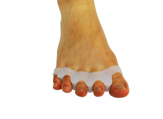 Foot wearing wide toe separators with wide band between toes