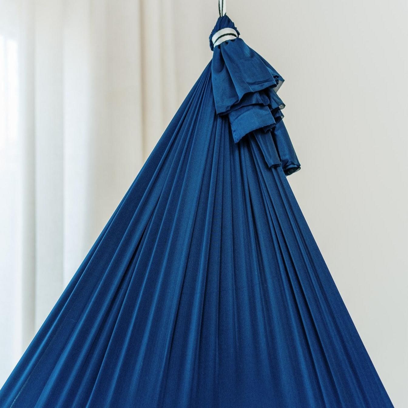 Navy therapy swing cocoon hanging with pleated, tiered fabric layers
