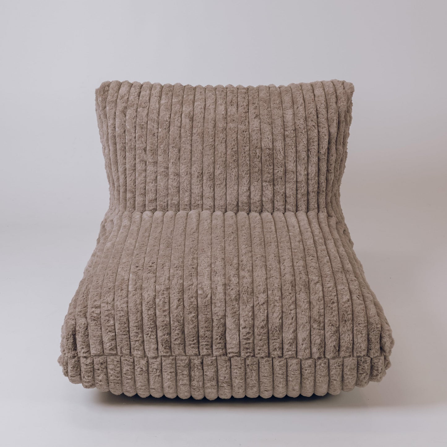 Taupe ribbed plush lounger with wide rounded arms and cushioned back