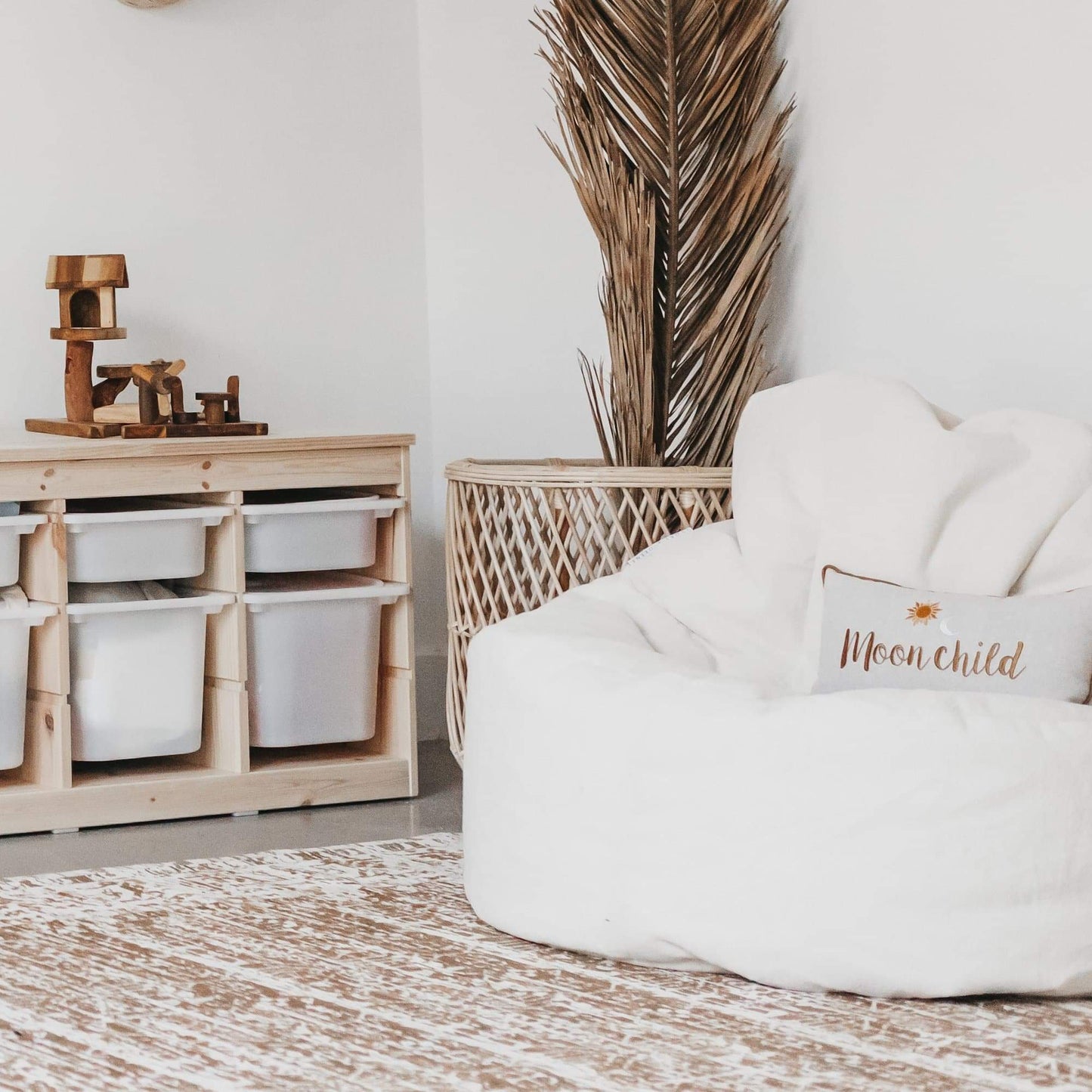 Cream plush bean bag chair cover corner view with 'Moonchild' pillow