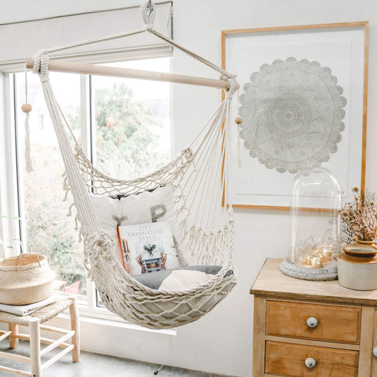 Natural macrame hammock chair with scalloped rope seat and hanging support cords
