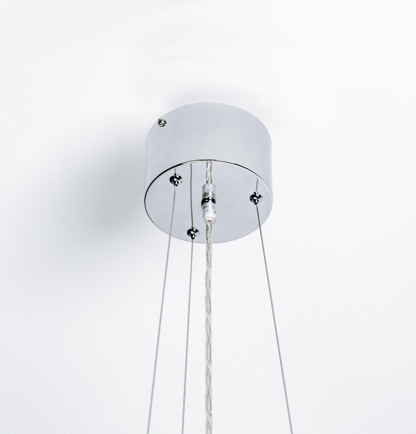 Chrome ceiling canopy for a crystal pendant light with three hanging cords