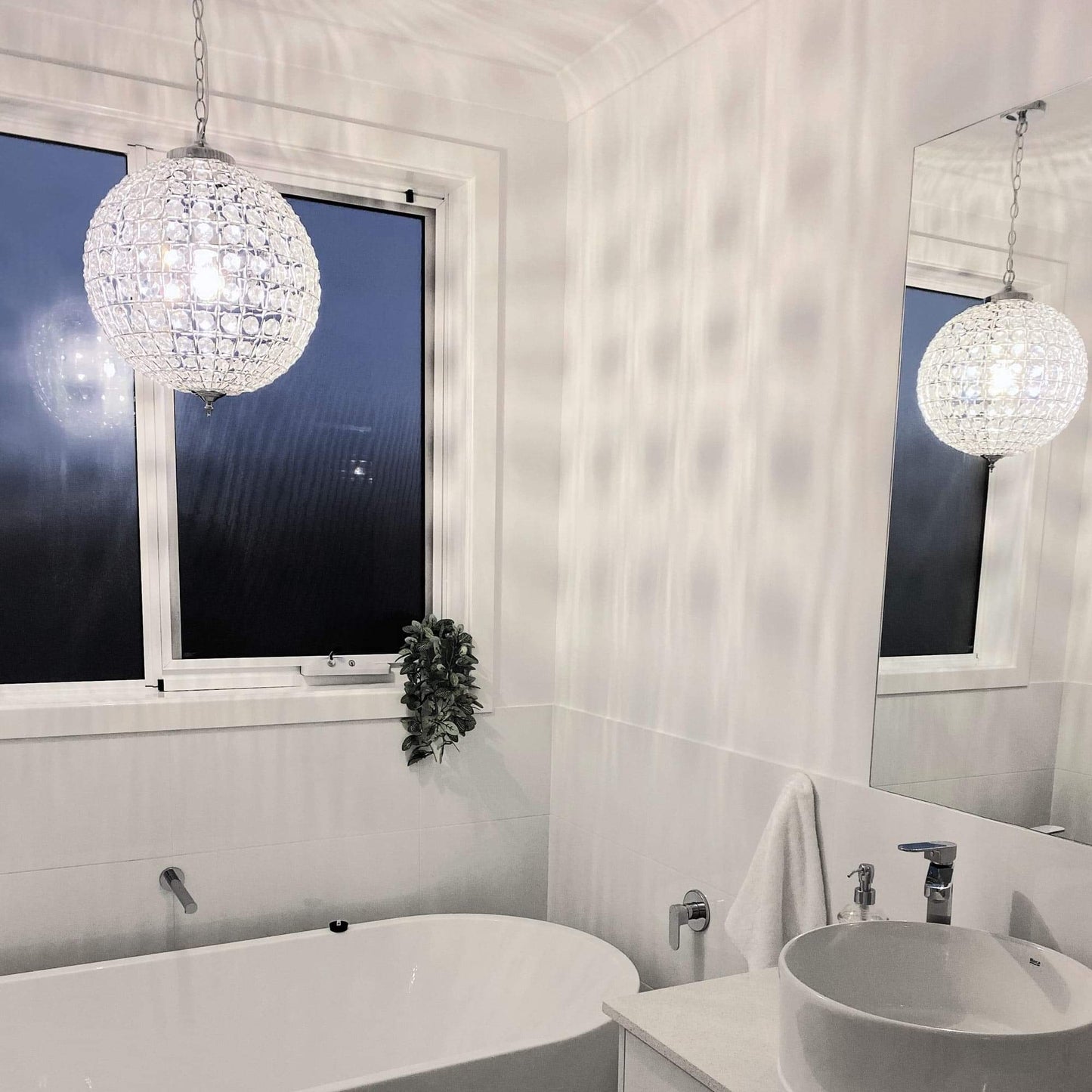Crystal globe pendant chandelier cluster with chrome stems and faceted clear glass globes