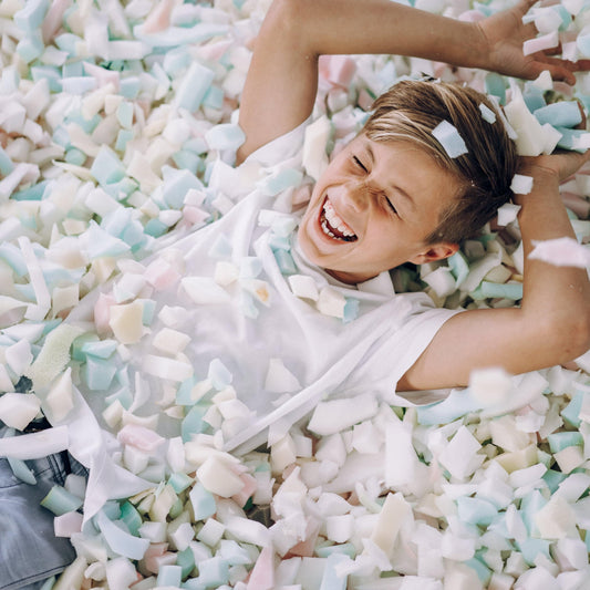 Pastel shredded foam filling with white, pink, and light blue foam pieces