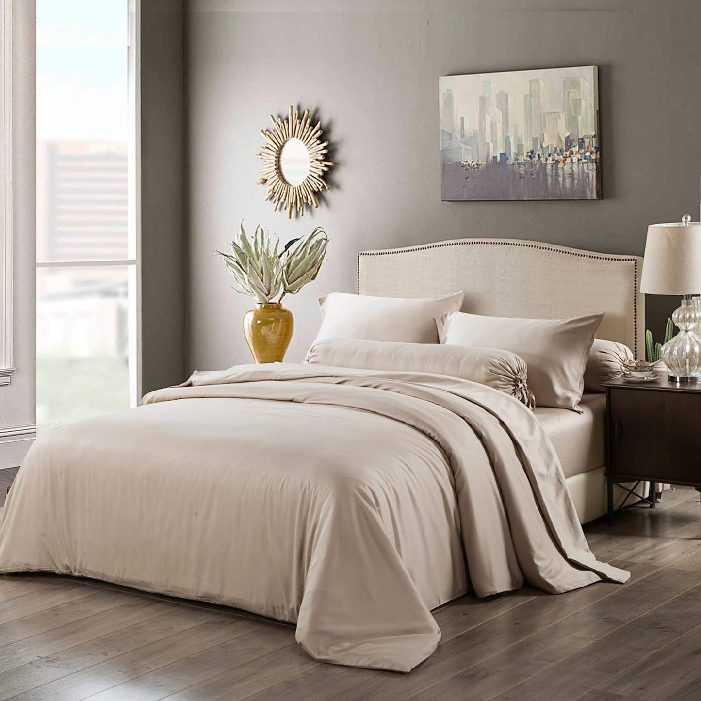 Light beige quilt cover and matching pillowcases on a neatly made bed