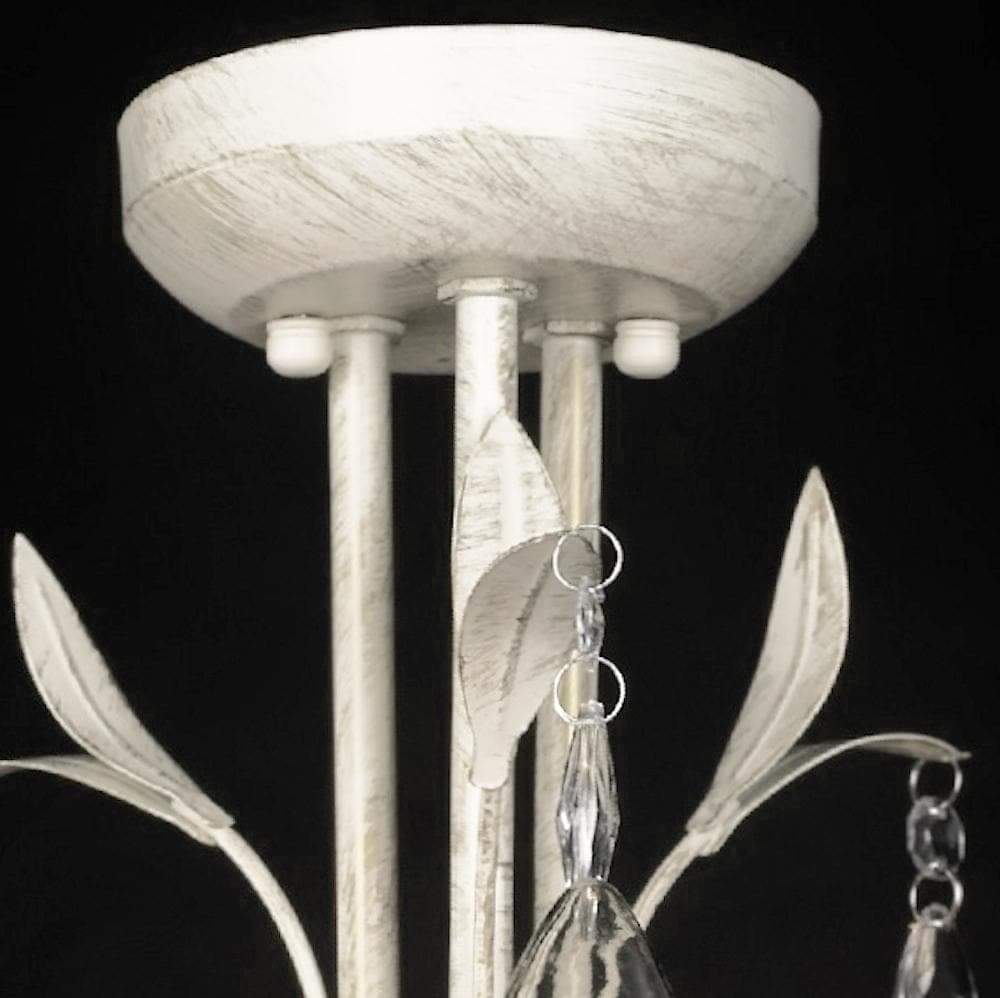 Top view of white 3-light chandelier canopy and stem with crystal hanging drops