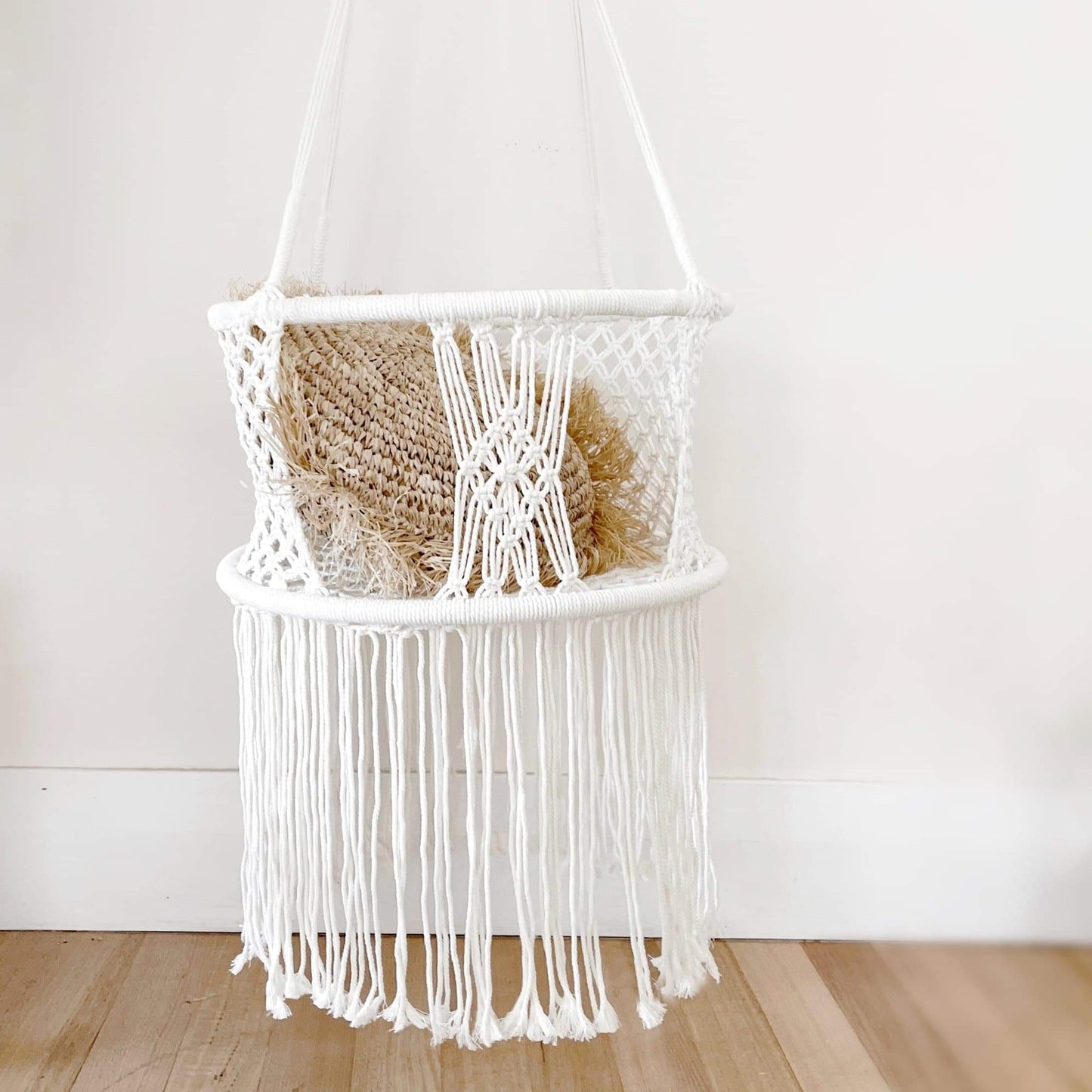 Cream macrame hanging baby swing chair hammock with woven seat and fringe