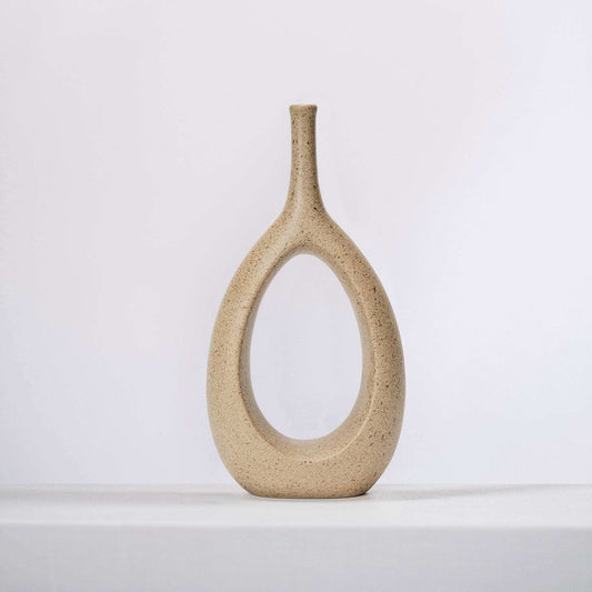 Speckled ceramic vase with tall narrow neck and oval opening, clay color