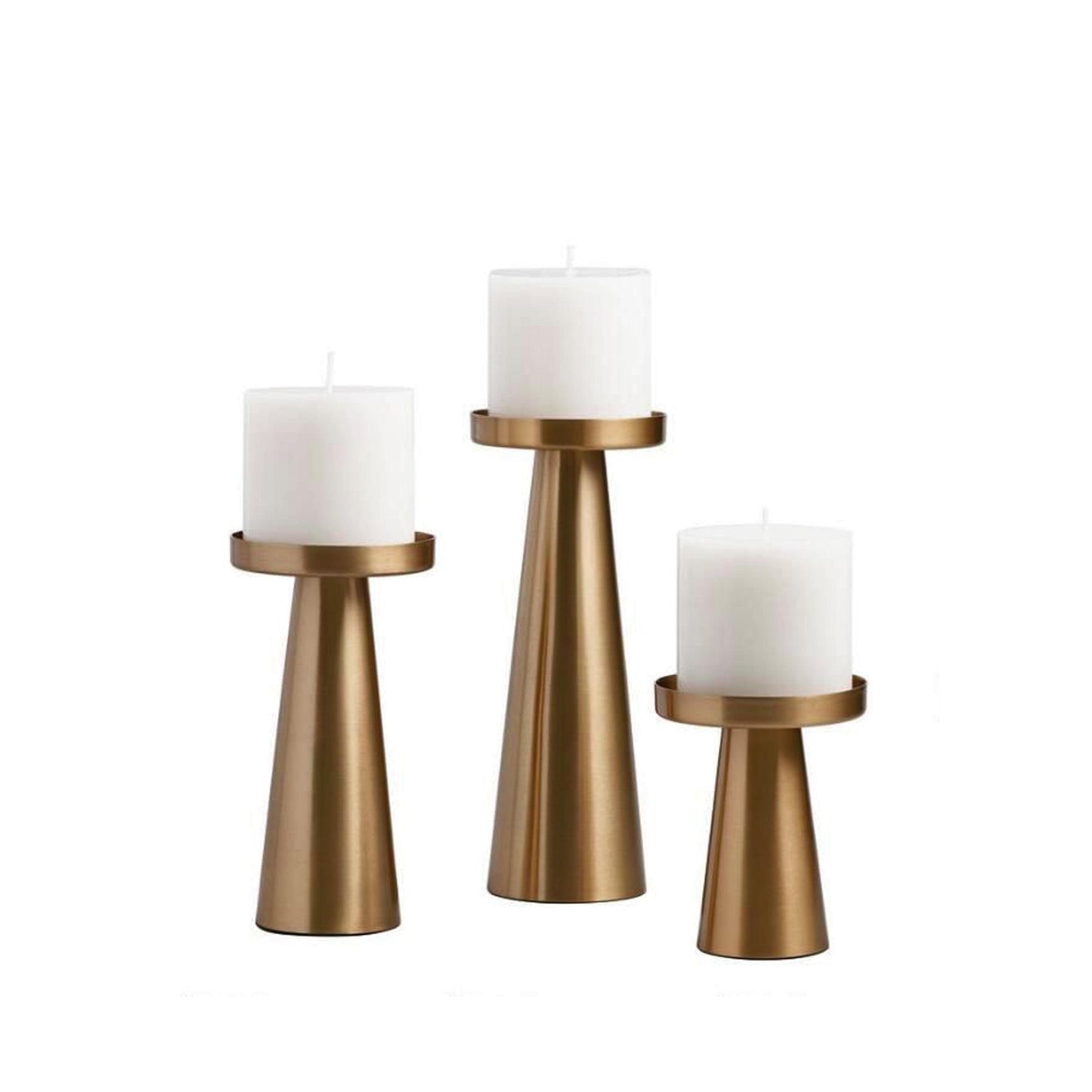 Three brushed brass candlesticks with white pillar candles, clean cylinder bases